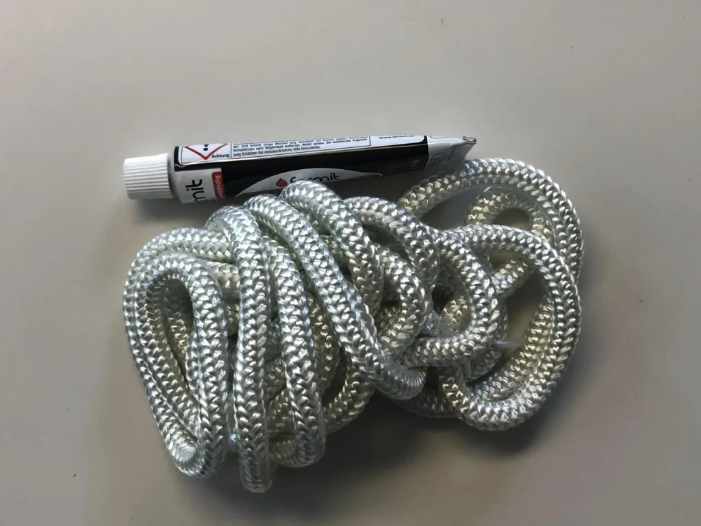 Glasfaserabdichtungsset 10 mm Durchmesser, 2,5 m lang, incl. 17 ml Kleber (Ofenabdichtung)